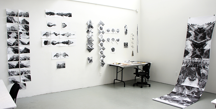 Studio installation view with artist books and paper works.